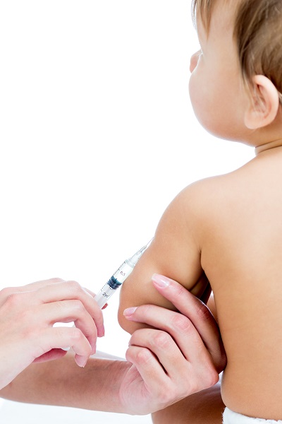 doctor vaccinating  baby isolated on a white background